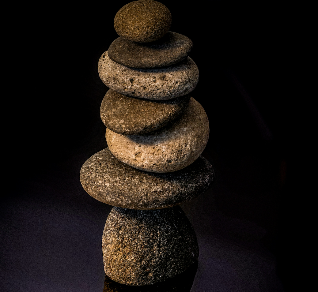 Balancing rocks to symbolise balancing a busy life and side hustle