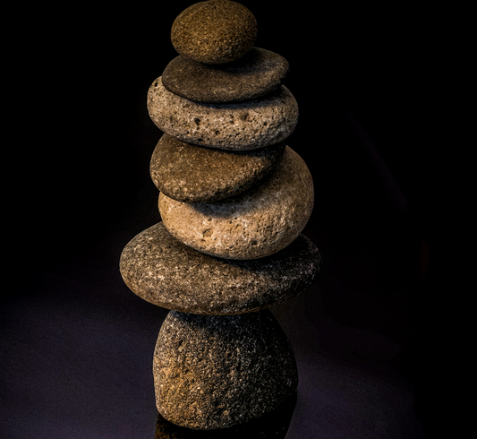 Balancing rocks to symbolise balancing a busy life and side hustle